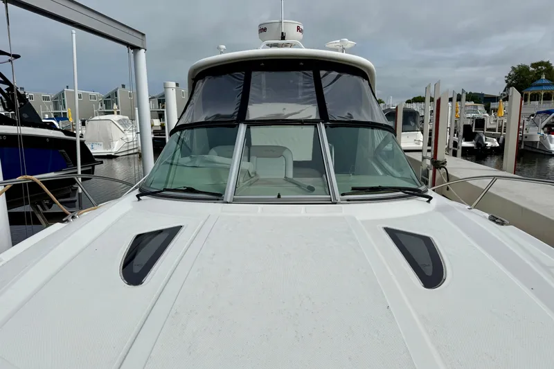 Flip Side Yacht Photos Pics 2010 Sea Ray 330 Sundancer docked at a marina, showcasing sleek design and modern features.