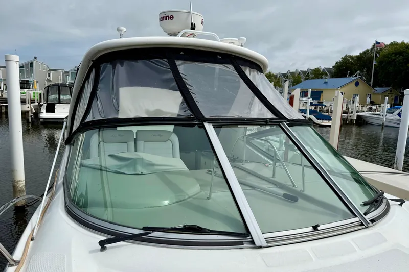 Flip Side Yacht Photos Pics 2010 Sea Ray 330 Sundancer docked at marina, featuring sleek windshield design.