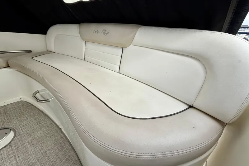 Flip Side Yacht Photos Pics Luxurious seating on 2010 Sea Ray 330 Sundancer boat, featuring elegant white upholstery.