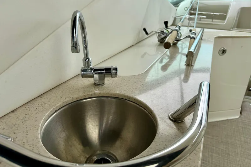 Flip Side Yacht Photos Pics Stainless steel sink and faucet on 2010 Sea Ray 330 Sundancer yacht.