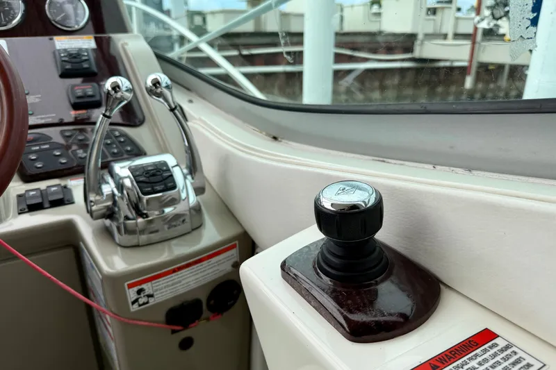 Flip Side Yacht Photos Pics Control panel of a 2010 Sea Ray 330 Sundancer boat with throttle and joystick.