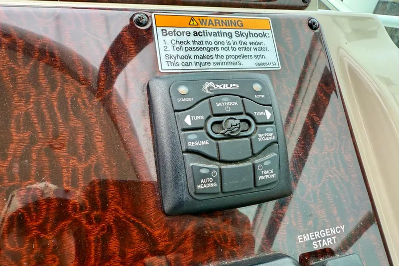 Flip Side Yacht Photos Pics Control panel of a 2010 Sea Ray 330 Sundancer with Skyhook system and warning label.