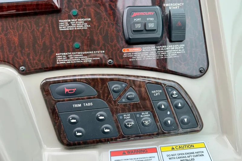 Flip Side Yacht Photos Pics Control panel of a 2010 Sea Ray 330 Sundancer boat with various switches and indicators.