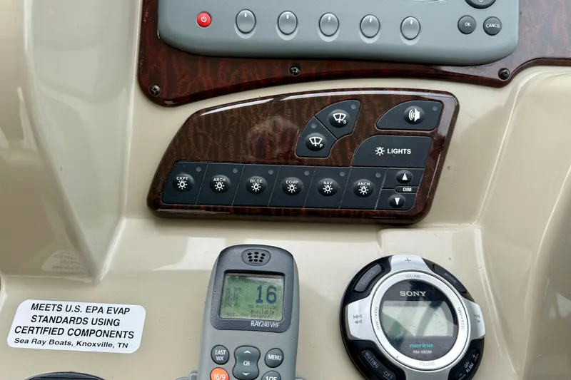 Flip Side Yacht Photos Pics Control panel of 2010 Sea Ray 330 Sundancer with radio and light switches.