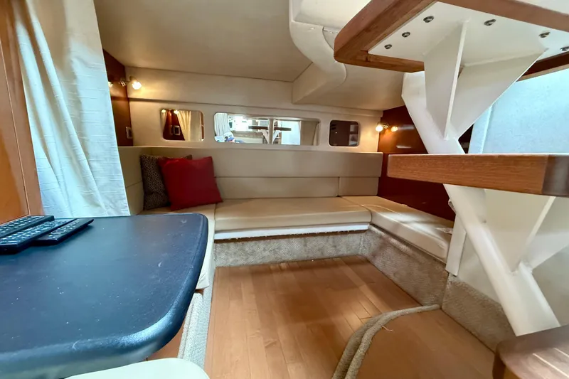 Flip Side Yacht Photos Pics Interior of 2010 Sea Ray 330 Sundancer yacht with cozy seating and modern design.