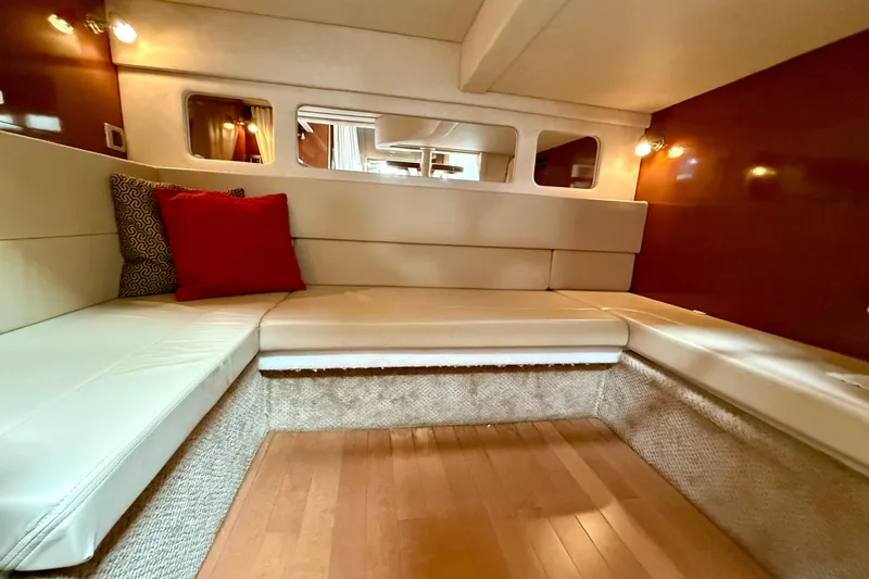 Flip Side Yacht Photos Pics Luxurious interior of 2010 Sea Ray 330 Sundancer with plush seating and elegant decor.