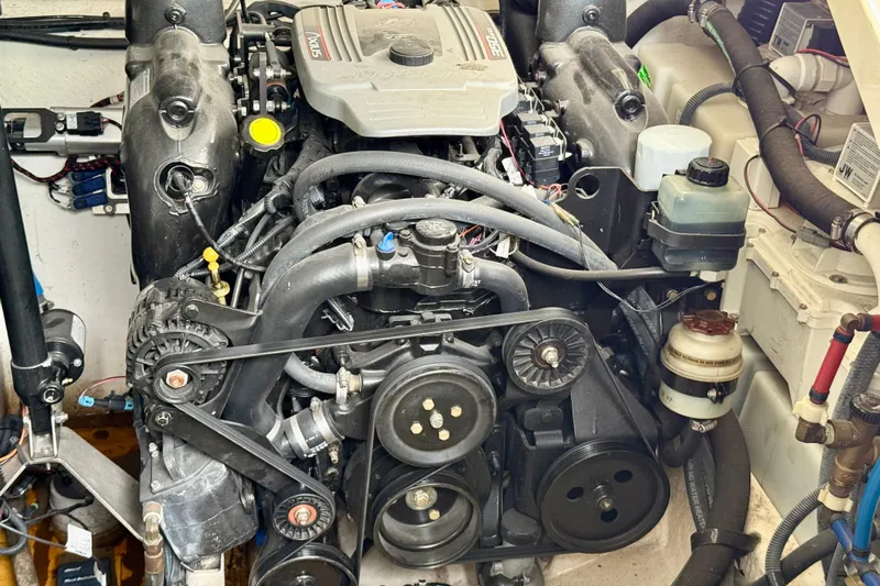 Flip Side Yacht Photos Pics Engine of a 2010 Sea Ray 330 Sundancer boat, showcasing mechanical components.