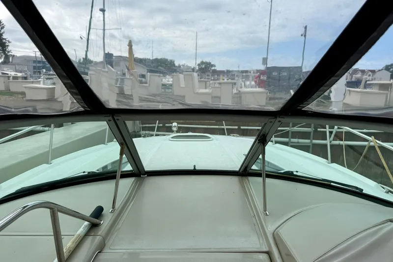 Flip Side Yacht Photos Pics View from the cockpit of a 2010 Sea Ray 330 Sundancer yacht in a marina.