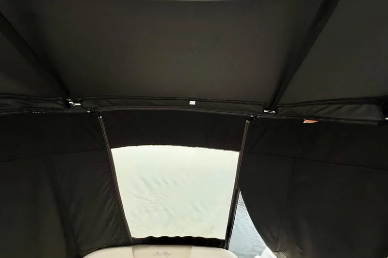 Flip Side Yacht Photos Pics Interior view of 2010 Sea Ray 330 Sundancer boat with black canopy.