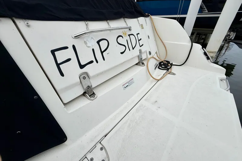 Flip Side Yacht Photos Pics 2010 Sea Ray 330 Sundancer boat with "Flip Side" name on the stern.