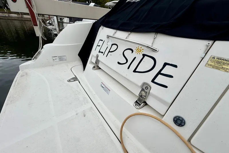Flip Side Yacht Photos Pics 2010 Sea Ray 330 Sundancer boat with "FLIP SIDE" text on the stern.