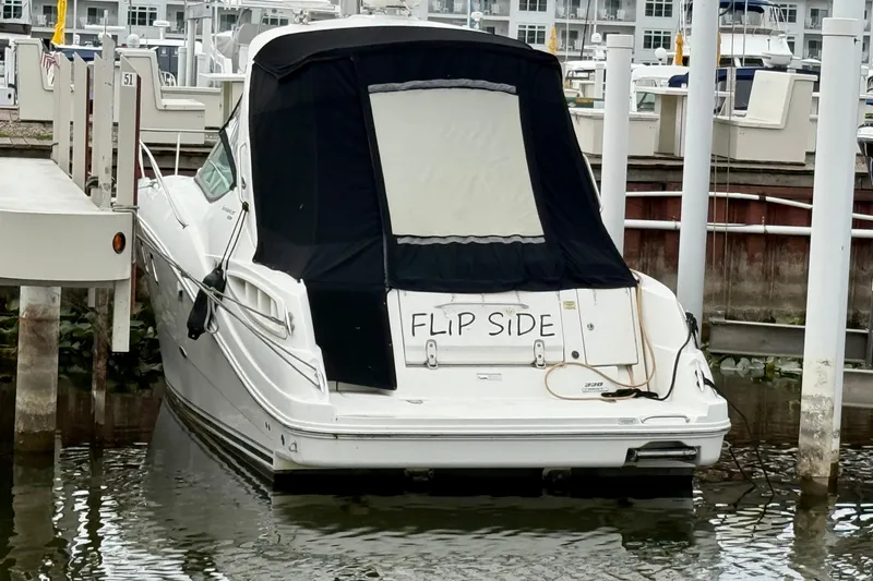 Flip Side Yacht Photos Pics 2010 Sea Ray 330 Sundancer docked, rear view with "Flip Side" sign.