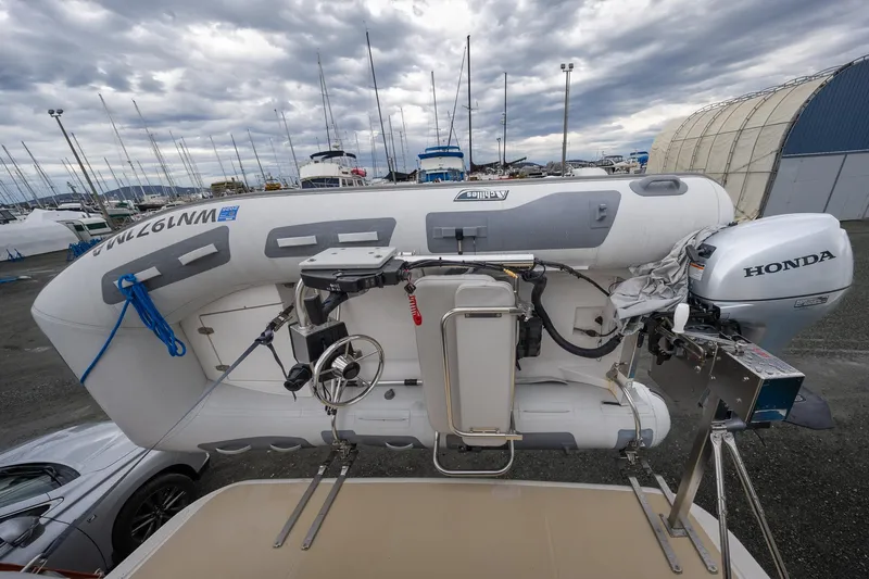 Power Play Yacht Photos Pics Inflatable boat with Honda motor on Sabre 38 Salon Express, 2014 model, in a marina setting.