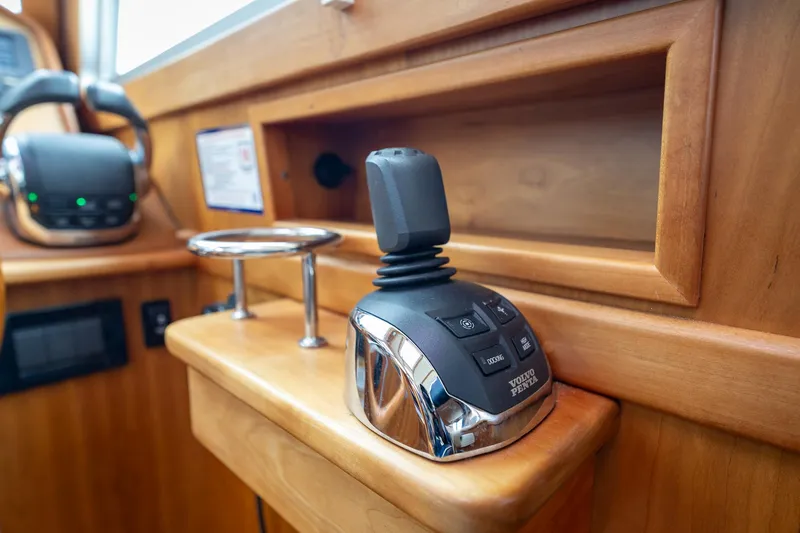 Power Play Yacht Photos Pics Control panel of 2014 Sabre 38 Salon Express yacht with joystick and cup holder.