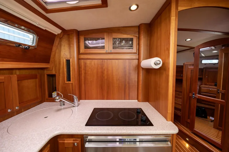 Power Play Yacht Photos Pics 2014 Sabre 38 Salon Express kitchen with wood cabinetry and modern appliances.