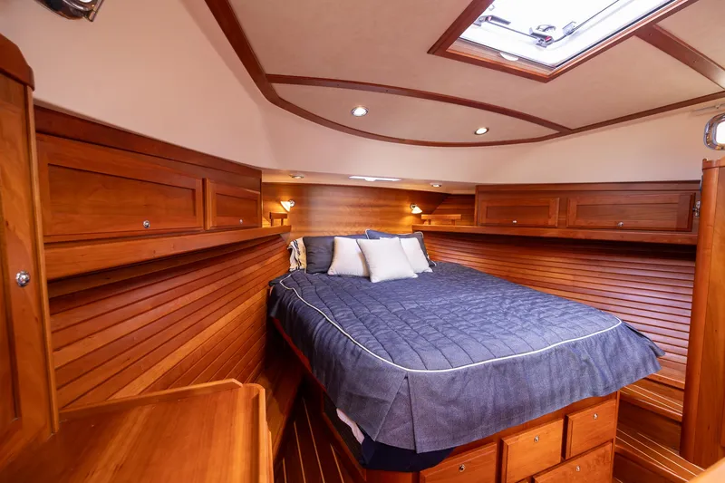 Power Play Yacht Photos Pics Luxurious wood-finished cabin interior of 2014 Sabre 38 Salon Express yacht.