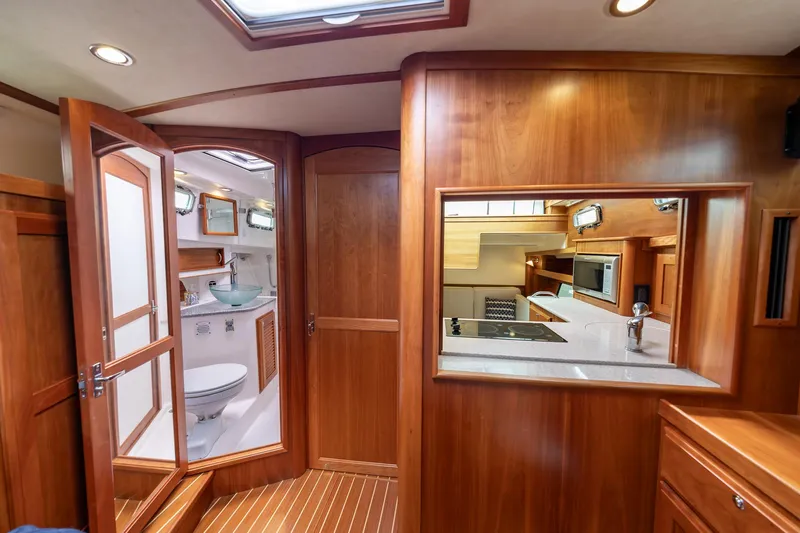 Power Play Yacht Photos Pics Interior of 2014 Sabre 38 Salon Express yacht, featuring wood finish and modern amenities.
