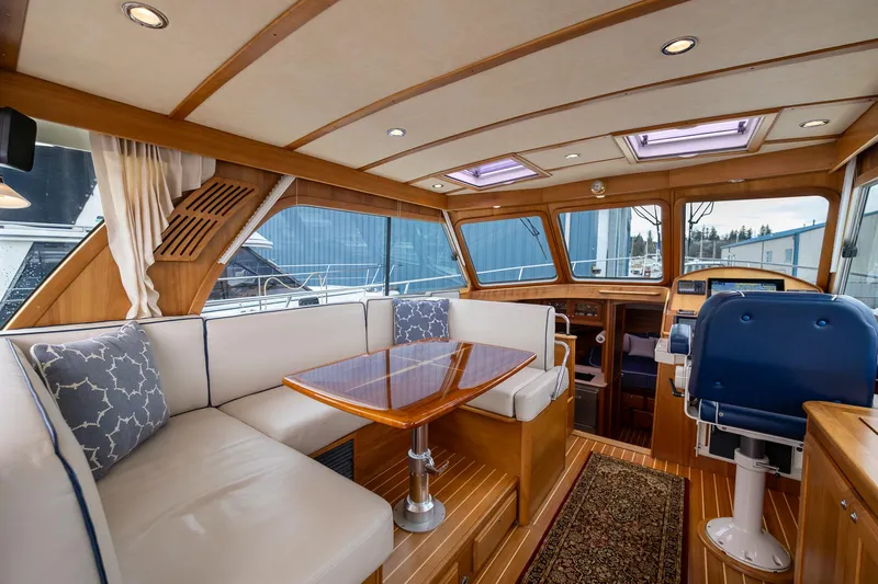 Power Play Yacht Photos Pics 2014 Sabre 38 Salon Express interior with elegant seating and wooden finishes.