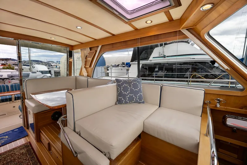 Power Play Yacht Photos Pics Interior of 2014 Sabre 38 Salon Express yacht with plush seating and elegant wood finish.