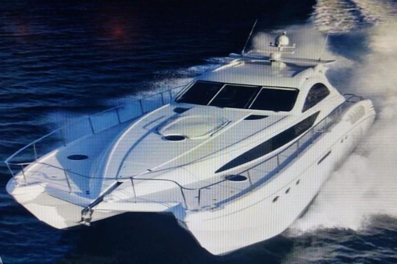 Custom Axcell Yachts 650 Power Catamaran cruising on water, 2010 model.