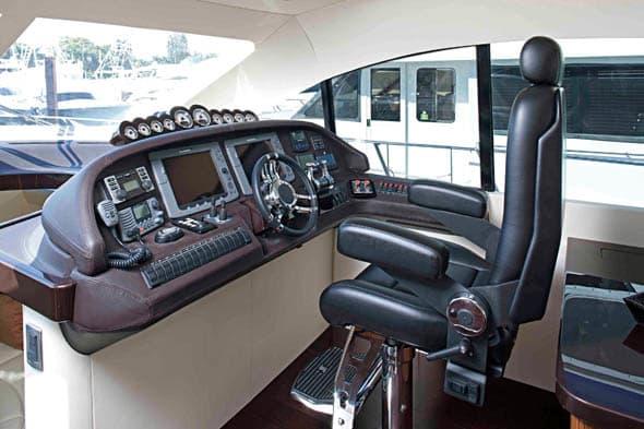 Luxurious helm of 2010 Custom Axcell Yachts 650 Power Catamaran with advanced navigation controls.