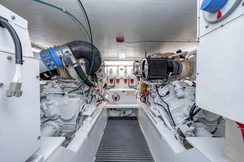  Yacht Photos Pics Engine room of 2000 Hatteras 50 Convertible yacht, showcasing dual engines and mechanical systems.