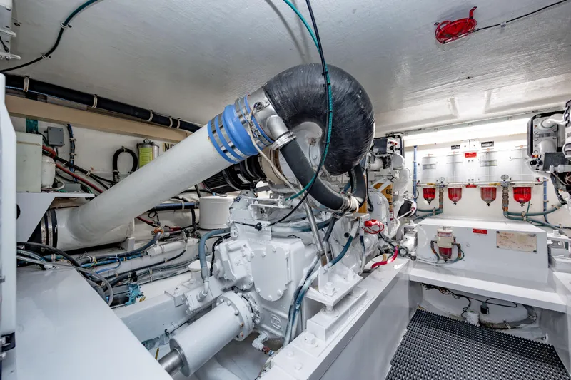  Yacht Photos Pics Engine room of 2000 Hatteras 50 Convertible yacht, showcasing machinery and components.