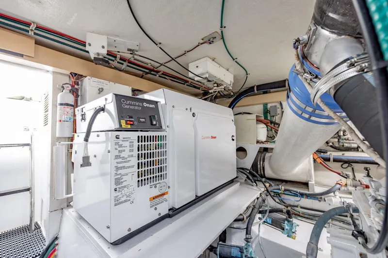  Yacht Photos Pics Engine room of 2000 Hatteras 50 Convertible with Cummins Onan generator.