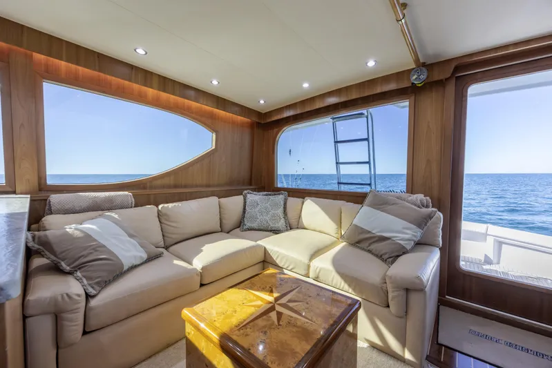  Yacht Photos Pics Luxurious interior of 2000 Hatteras 50 Convertible yacht with ocean view.