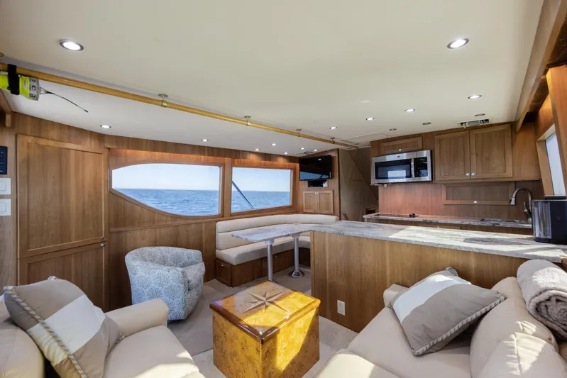  Yacht Photos Pics Luxurious interior of 2000 Hatteras 50 Convertible yacht with ocean view.