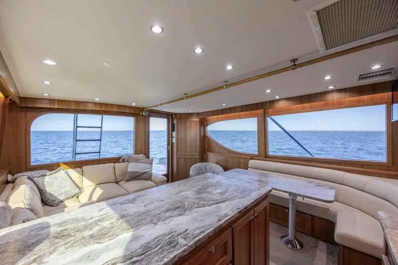 Yacht Photos Pics Luxurious interior of 2000 Hatteras 50 Convertible yacht with ocean view.