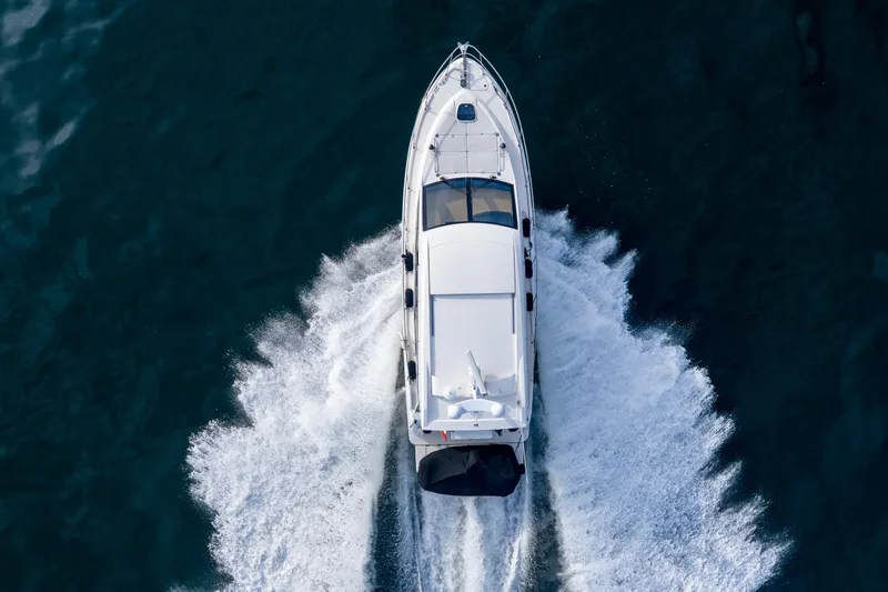  Yacht Photos Pics Aerial view of 2016 Sea Ray Sundancer 400 yacht cruising on open water.