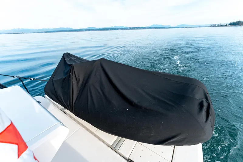  Yacht Photos Pics 2016 Sea Ray Sundancer 400 with covered equipment on deck, cruising on calm waters.