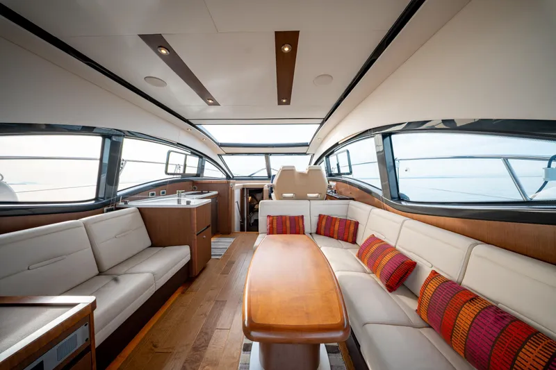  Yacht Photos Pics Luxurious interior of 2016 Sea Ray Sundancer 400 yacht with elegant seating and modern design.