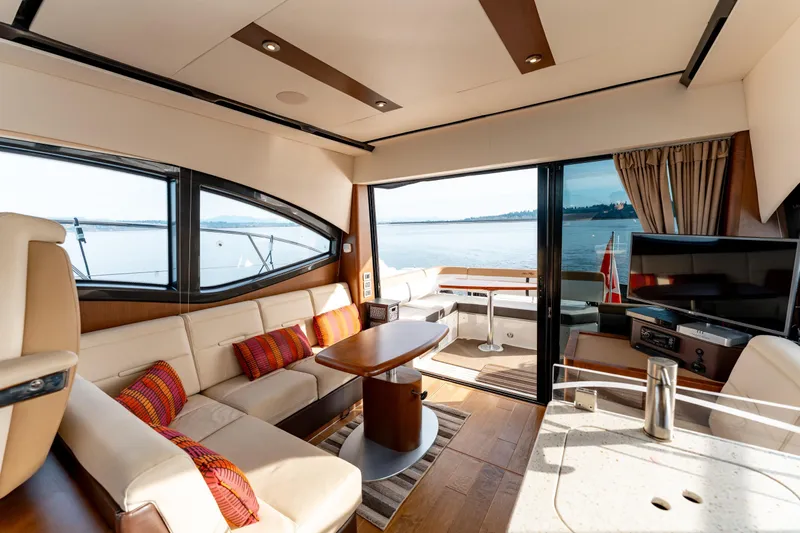  Yacht Photos Pics Luxurious interior of 2016 Sea Ray Sundancer 400 yacht with scenic water view.