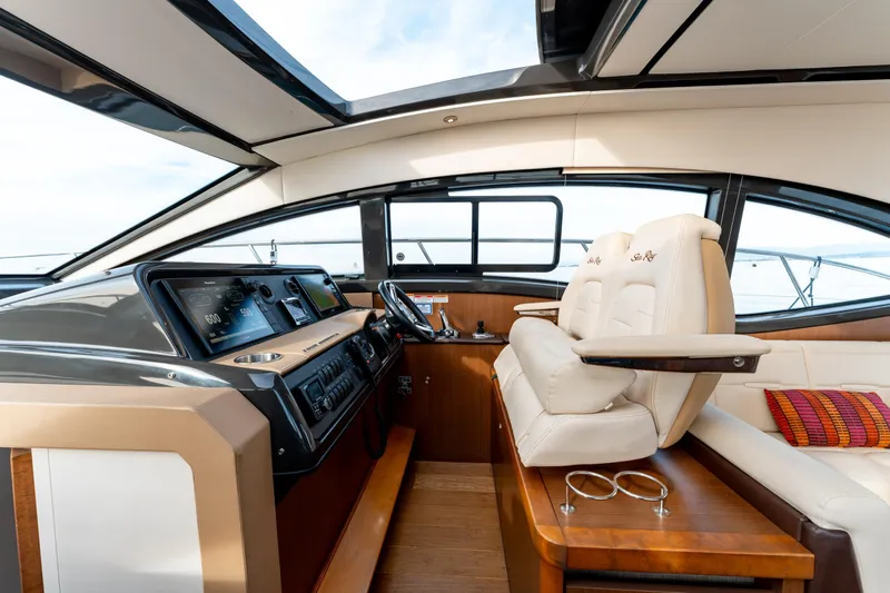  Yacht Photos Pics Luxurious 2016 Sea Ray Sundancer 400 yacht interior with modern helm and plush seating.