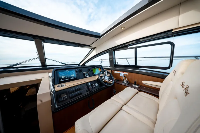  Yacht Photos Pics Luxurious 2016 Sea Ray Sundancer 400 helm with modern controls and plush seating.
