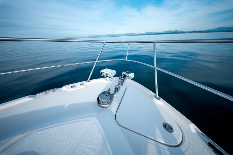  Yacht Photos Pics Bow view of 2016 Sea Ray Sundancer 400 on calm waters.