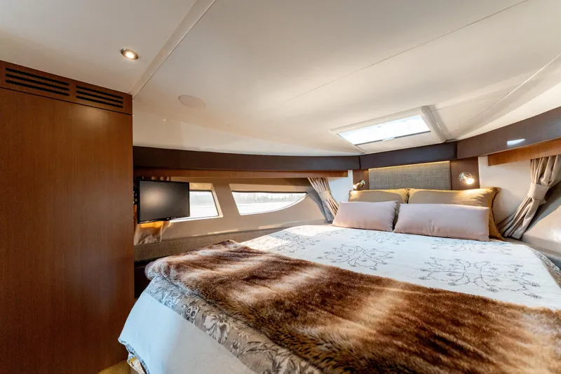  Yacht Photos Pics Luxurious cabin interior of 2016 Sea Ray Sundancer 400 yacht with cozy bedding.