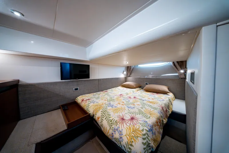  Yacht Photos Pics Luxurious cabin interior of 2016 Sea Ray Sundancer 400 yacht with cozy bedding.