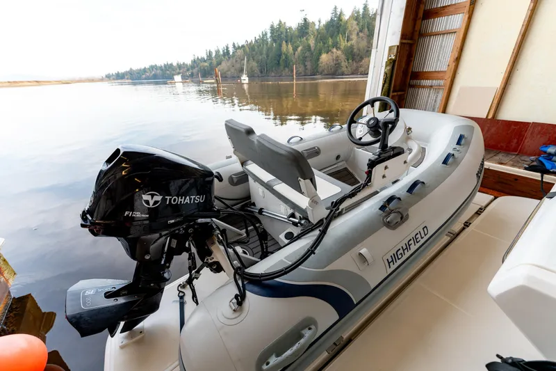  Yacht Photos Pics Highfield inflatable boat with Tohatsu engine docked near a Sea Ray Sundancer 400, 2016 model.