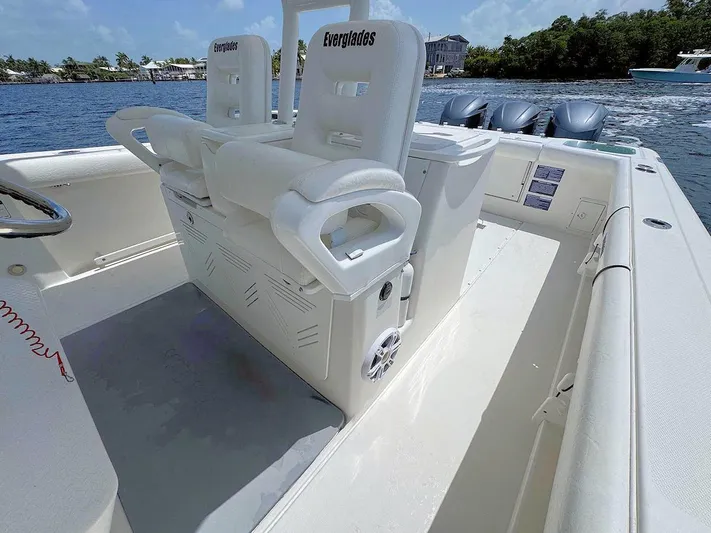  Yacht Photos Pics 2010 Everglades 350 CC boat interior with white seating and ocean backdrop.