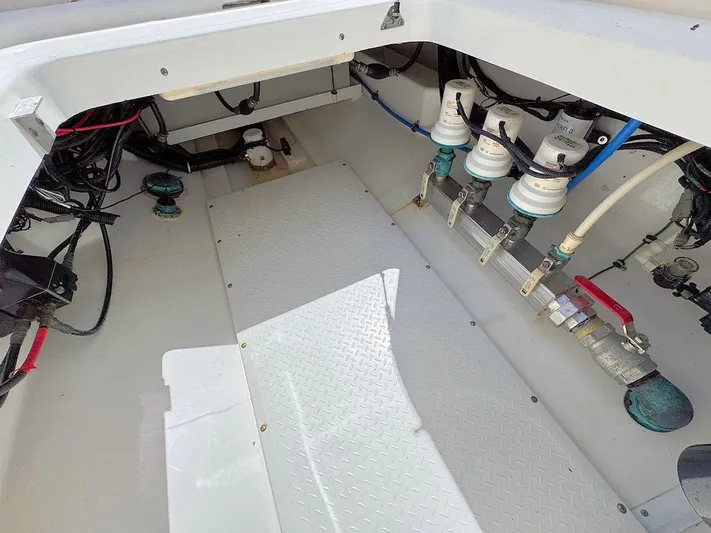  Yacht Photos Pics Interior view of a 2010 Everglades 350 CC boat showing mechanical components and wiring.