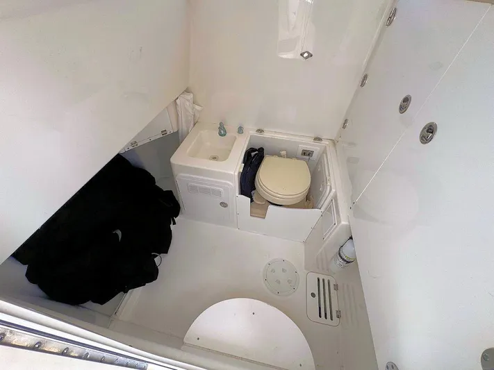  Yacht Photos Pics Interior of 2010 Everglades 350 CC boat bathroom with sink and toilet.