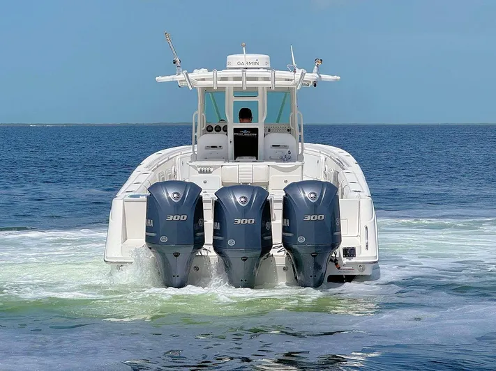  Yacht Photos Pics Everglades 350 CC boat with triple Yamaha 300 engines on open water, 2010 model.