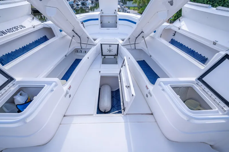 Chasing Chari Yacht Photos Pics 2016 Intrepid 400 Center Console boat with open storage compartments and clean deck layout.