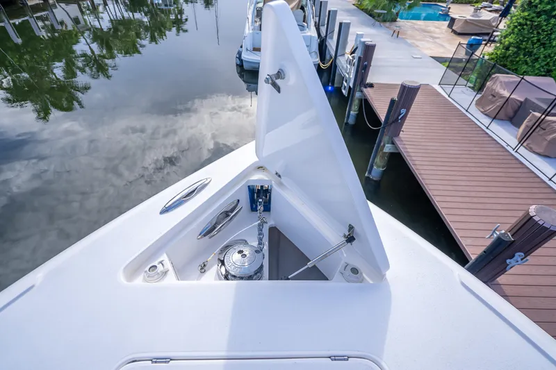 Chasing Chari Yacht Photos Pics 2016 Intrepid 400 Center Console anchor compartment open at dockside.