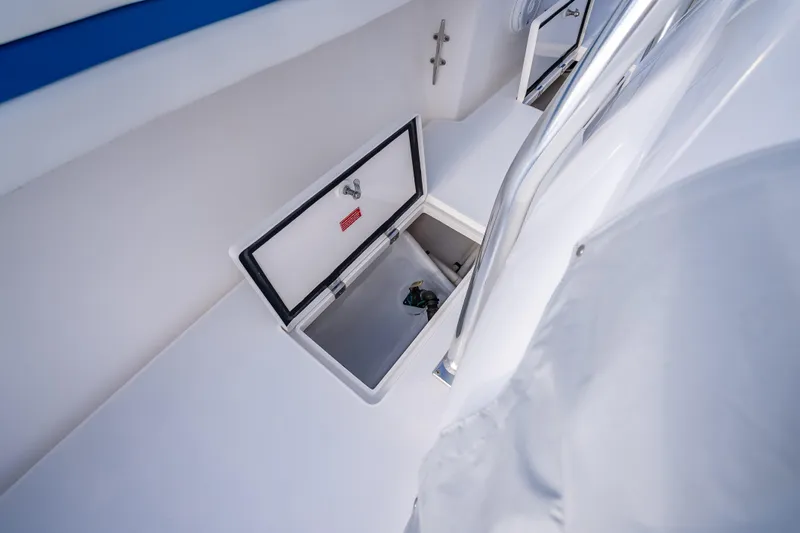 Chasing Chari Yacht Photos Pics Open storage compartment on 2016 Intrepid 400 Center Console boat deck.