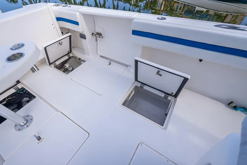 Chasing Chari Yacht Photos Pics 2016 Intrepid 400 Center Console boat deck with open storage compartments.