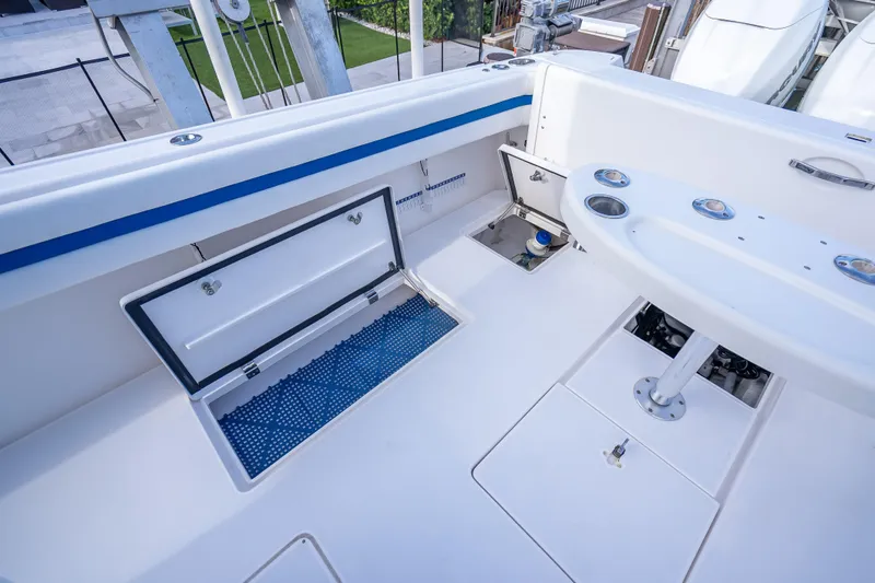 Chasing Chari Yacht Photos Pics 2016 Intrepid 400 Center Console boat interior with storage compartments and seating area.